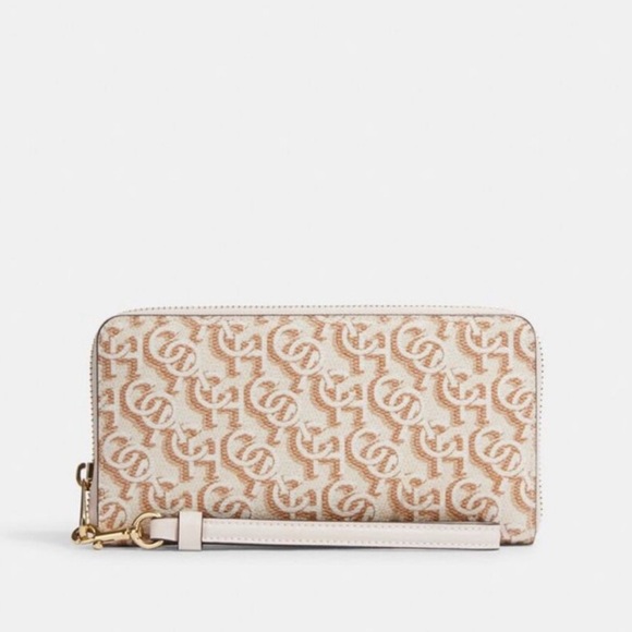 Coach Handbags - Coach Beige and White Monogram Wristlet